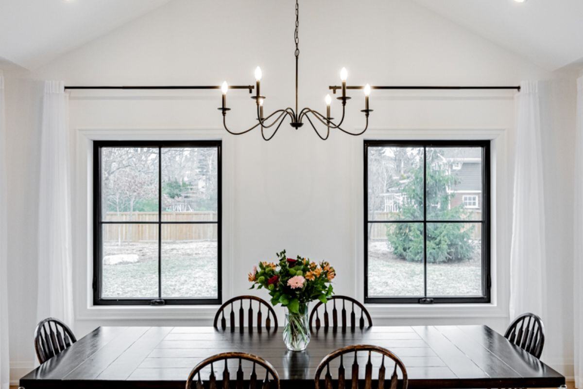 Wood table in dining room with natural light | Ever After Homes